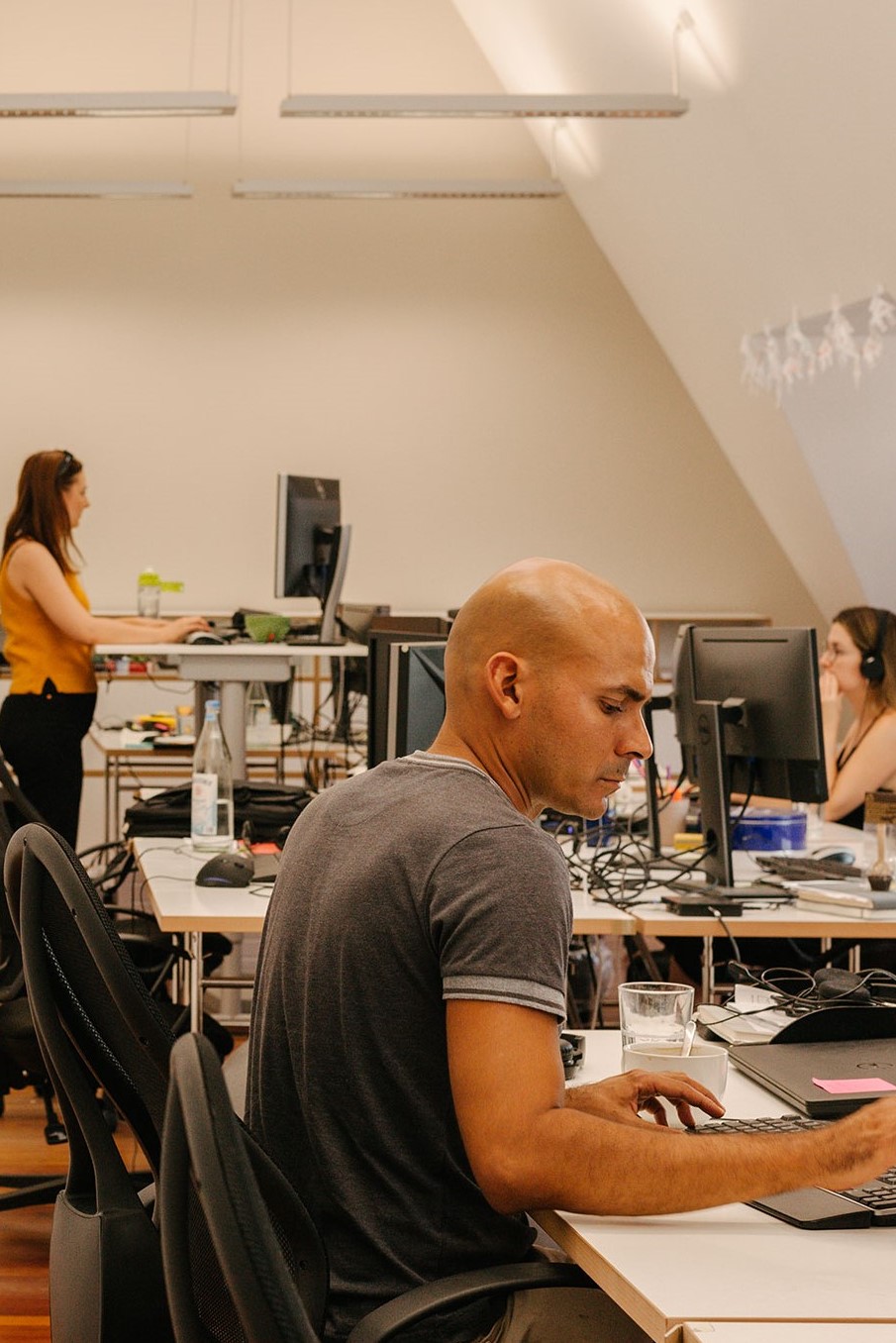 ctrl-qs-employees-working-at-their-desks